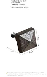 Macro view of vintage square cast iron drawer handle with rustic industrial finish