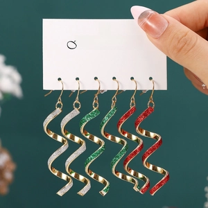 Three-pair Christmas set of spiral drop earrings in silver, green, and red glitter finish