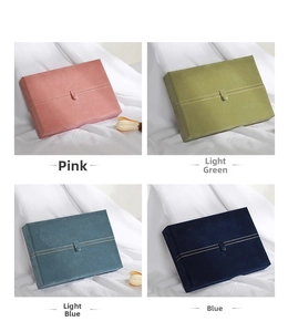 Rectangle velvet jewelry boxes in pink, light green, light blue, and dark blue with buckles