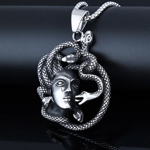 Gothic stainless steel Medusa pendant necklace with snake details on a black display