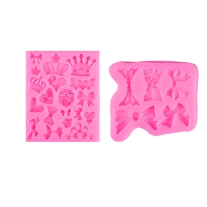 Pink silicone crown and bow molds for DIY fondant, clay, and resin crafting designs
