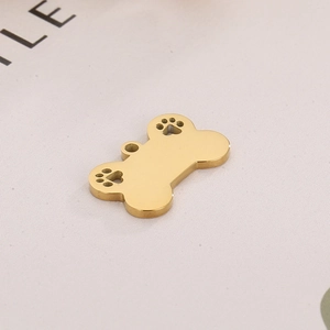 Polished gold bone-shaped pet tag with hollow paw prints and integrated hanging loop