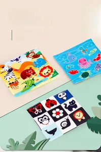 Detail of baby soft books showing colorful animal graphics and English learning words