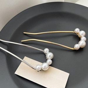 Elegant U-shaped hair pins with white pearls in gold and silver finish for bun hairstyles