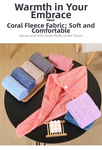 Close-up of soft coral fleece hair towel wrap and rolled microfiber towels on a tray
