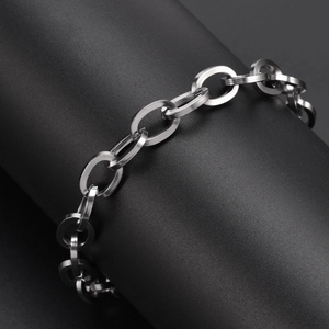 Macro shot of 9mm wide polished silver stainless steel oval link chain bracelet detail