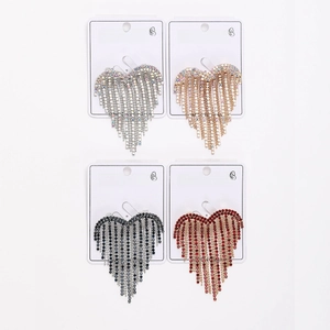 Detail view of heart-shaped tassel earrings with rhinestones in four elegant colors