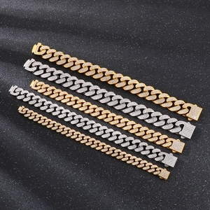 Detail of Hip Hop cuban link bracelets in gold and silver finish with crystal pavé settings
