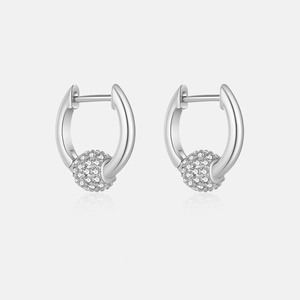 Detailed macro view of S925 silver hoop earrings with sparkling pavé zircon ball drops
