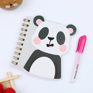 Cute panda-shaped coil notebook with pink ballpoint pen on clean white background