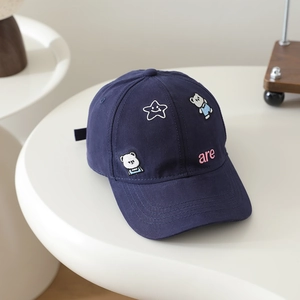 Detail of navy cotton baseball cap featuring cute bear and star embroidery for children