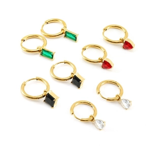 Set of four gold hoop earrings with green, red, black, and clear gemstone pendants