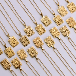 18K gold plated stainless steel rectangle A-Z initial necklaces in a structured array