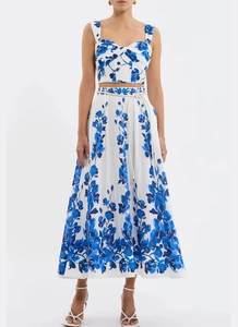 Detail of blue floral print two-piece set featuring cropped top and high waist maxi skirt