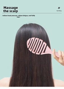 Pink vented hairbrush with curved hollow design for scalp massage and blow-drying