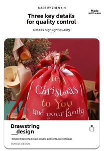 Detail of red Christmas gift bag with white Merry Christmas print and drawstring closure