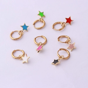 Set of seven gold stainless steel hoop earrings with colorful star pendants in candy colors