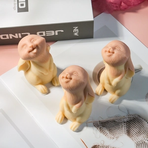 Detailed view of three cute 3D bunny molds for handmade Easter candles and plaster crafts