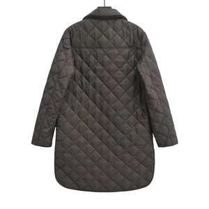 Detail view of the diamond quilted pattern and back stitching on this long winter coat