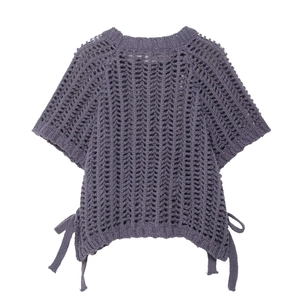Detail of purple open-knit crochet top with side tie-up strings on white background