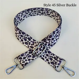 Close-up of purple leopard print replacement bag strap with silver metal lobster clasps
