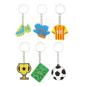 Set of 6 PVC soccer keychains featuring blue shoes, trophy, jersey, and mini ball