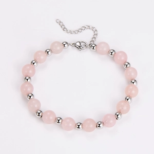 Close-up of pink crystal beads bracelet with silver lobster clasp and extension chain