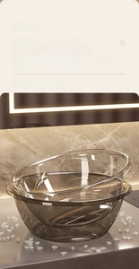 Macro detail of stackable amber transparent PET basins with high gloss luxury finish