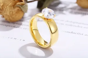Macro side view of a classic 6mm round cubic zirconia solitaire ring with gold plating