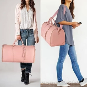 Pink PU leather travel duffel bag with handles and tassel zipper on a female model