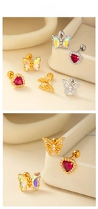 Detail of titanium steel heart and butterfly stud earrings with red gems and screw backings