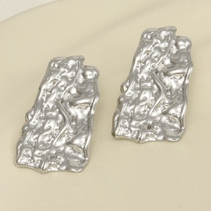Detailed shot of silver textured earrings with modern irregular 304 stainless steel surface