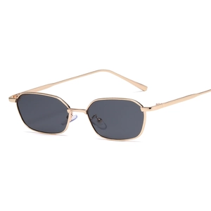 Polygonal small frame sunglasses with gold metal rims and dark grey lenses for a retro look