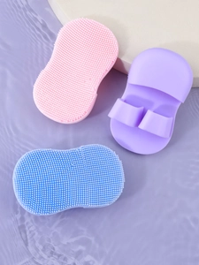 Three-piece set of mini silicone facial brushes with soft bristles and finger handles