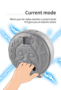 Detail view of electric lie detector toy with glowing blue light shock effect