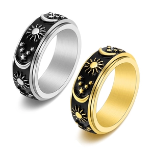Stainless steel celestial spinning ring set with moon and sun patterns for stress relief