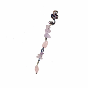 Detail of pink crystal natural stone pendant with spiral metal coil for braided hair