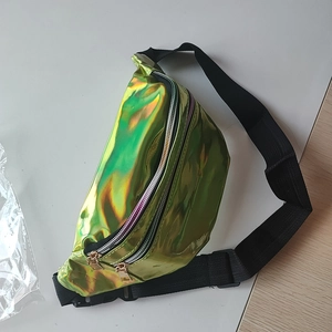 Macro view of iridescent laser waist bag featuring waterproof fabric and double zippers