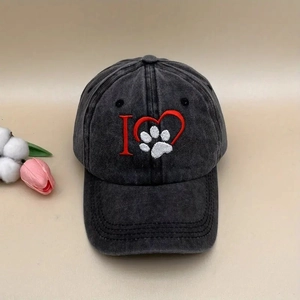 Detailed embroidery of heart and paw print on vintage washed cotton baseball cap
