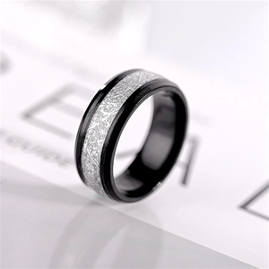 Detail view of titanium steel ring with a unique silver frost texture and black edges
