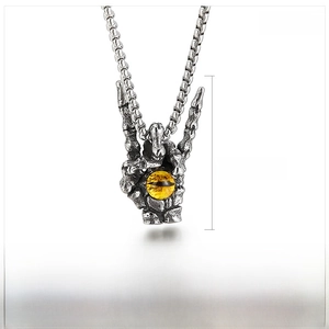Detailed punk skull hand pendant with tiger eye stone, measures 44x25mm and weighs 14g