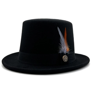 Detail of wool top hat featuring a grosgrain ribbon, feathers, and an anchor embossed button