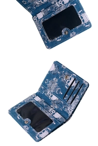 Close-up of skull print wallet featuring card slots and a transparent ID window