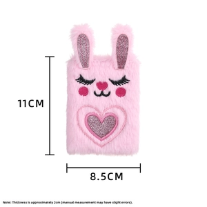 Detail of pink plush rabbit notebook with sequins and embroidery measuring 11x8.5cm