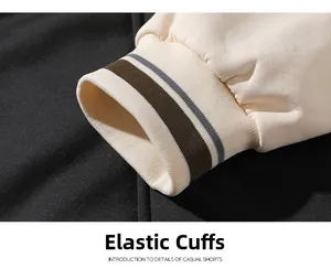 Close-up of elastic ribbed cuffs with brown and gray stripes on a winter thermal hoodie