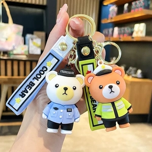 Cute silicone police bear keychains with blue and neon green uniforms on metal rings