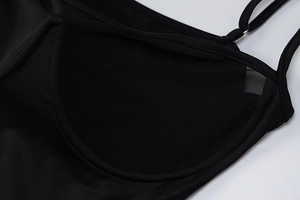 Close-up of black mesh inner lining and strap stitching on a slim fit dress