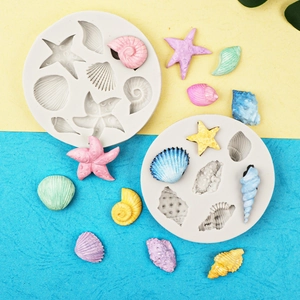Macro detail of ocean themed silicone molds featuring starfish and seashell shapes