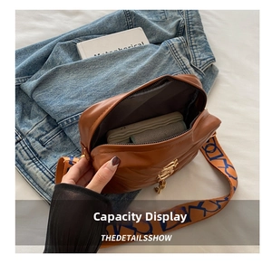 Internal view of brown leather crossbody bag showing large capacity for daily items