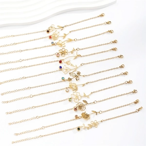Gold stainless steel bracelets featuring 12 months birth flower pendants and tiny birthstones